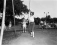 Primary view of [Child on a swing at WBAP picnic]