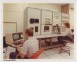 Photograph: [Photograph of workers at the Avionics Hot Bench]