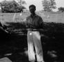 Photograph: [Photograph of a man standing outside]