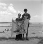 Photograph: [Family holding a flag]
