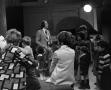 Photograph: [Photograph of many children gathered around Bill Kelley at a KXAS Ch…