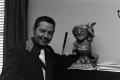 Photograph: [Guy Woodward Jr. smiling with a statue]