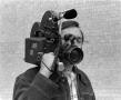 Photograph: [Photograph of David Young posing with a camera, 3]