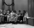Photograph: [Photograph of Bill Kelley and children at a KXAS Christmas Children'…