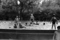 Photograph: [Photograph of children swimming in a pool]