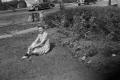 Photograph: [Frances Sitting in a Front Yard]