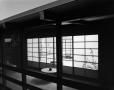 Photograph: [Windows and walkway of a Japanese-inspired cabin]