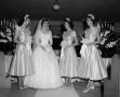 Photograph: [A bride with her bridesmaids]