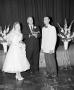 Primary view of [Bride, groom and the officiant]