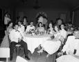 Photograph: [Young adults seated at a table together]