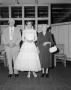 Photograph: [Bride with an older couple]
