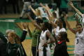 Photograph: [UNT Women's Basketball team holding up talons]