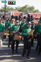 Photograph: [Mean Green Brigade drumline in UNT Homecoming Parade, 2007]