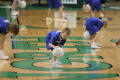Photograph: [Children dribbling on court during half-time game]