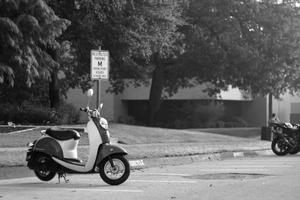 Primary view of object titled '[Vespa parked on UNT campus]'.