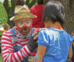 Photograph: [Clown and child at Denton Arts & Jazz Festival]
