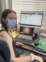 Photograph: [Student wearing a face mask at their desk]