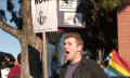 Photograph: [Protester yelling after Rainbow Lounge raid]