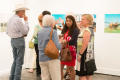 Photograph: [Small crowd at exhibit reception]