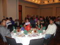 Photograph: [Guests around Celebración Banquet table]