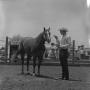 Photograph: [A man with his horse]