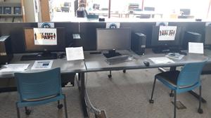 Primary view of object titled '[Public computer workstations at East Arlington Public Library with social distancing signage]'.