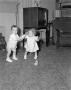 Photograph: [Photograph of Pam and Byrd IV in a living room as toddlers, 2]