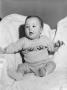 Photograph: [Photograph of Byrd Williams IV posing on a couch as a baby]