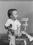Photograph: [Photograph of Byrd Williams IV holding a phone as a toddler]