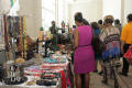 Photograph: [People gathered by accessory booth at 2012 TABPHE conference]
