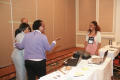 Primary view of [Group speaking to woman at 2012 TABPHE conference]