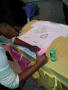 Photograph: [Woman designing shirt from Clothesline Project]