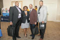 Photograph: [Four people in hall at 2012 TABPHE conference]