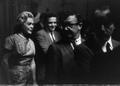 Photograph: [Alice Faye walking with a group of people]