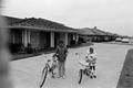 Photograph: [Angela and Dion Pride with their bicycles, 3]