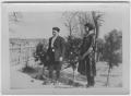 Photograph: [A girl and boy standing outdoors]