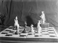 Photograph: [Photograph of a chess set with two figurines]