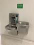 Photograph: [Drinking fountain and COVID-19 signage on UNT campus]