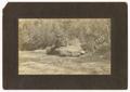 Photograph: [Two men sitting on a rock]