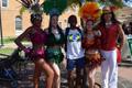 Photograph: [Student in Brazil shirt and dancers at 2015 Carnaval]