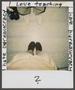 Photograph: [Two individuals' legs]