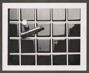 Primary view of object titled '[Lipstick on a tile backdrop]'.