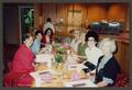 Photograph: [Smiling women sitting at table]