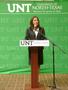 Photograph: [Cynthia Izaguirre speaking at Grand Re-Opening]