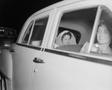 Photograph: [Newlyweds Glenella and Robert (Bob) Scarborough in an automobile]