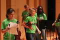 Photograph: [Students holding violins at the UNT Music Summer Orchestra Day Camp]