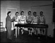 Photograph: [Five Athletes Basketball Athletes & Coach, 1940s]