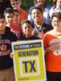 Photograph: [Student holding Generacion TX sign]
