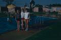 Photograph: [Pam and two friends at a pool]