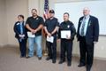 Photograph: [Elizabeth Patel, John Anderson with first responders at awards cerem…